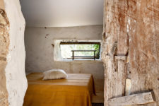 07 The second bedroom is done with bright printed textiles, a low bed and a small window