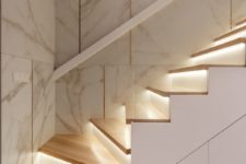 08 The staircase is very chic, done in white with additional lights
