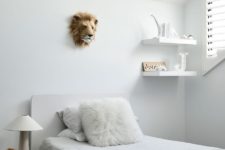 09 The kid’s room is all-white and off-white, with some furniture and a touch of fun