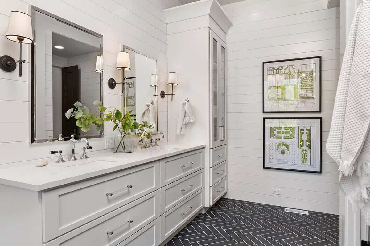 The master bathroom is done with white shiplap and a grey tile floor