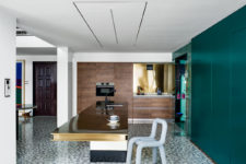 10 There are also wooden cabinets with built-in appliances and a polished gold backsplash
