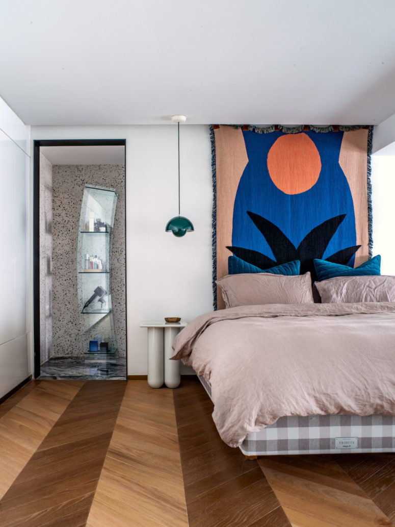 Catchy furniture is seen here, too - look at this curved glass unit for storage