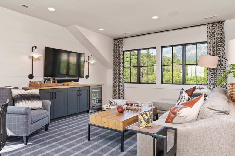 Patterned curtains frame the windows in each of the rooms, adding texture and character to the interior design Patterned curtains frame the windows in each of the rooms, adding texture and character to the interior design