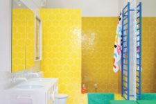 24 a super colorful bathroom with hex yellow tiles, colorful ottomans and bright textiles and a blue radiator