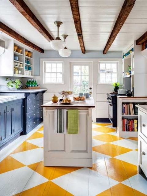 Home Design Ideas and Tips: 25 Catchy And Bold Blue And Yellow Kitchens Home Design Ideas and Tips: a bright kitchen with a geometric yellow and white floor navy cabinets and dark stained wooden beams on the ceiling