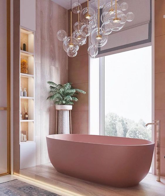 a cool bathroom with pink plywood walls, a pink tub, lit up built-in shelves and lots of bubble lights over the bathtub
