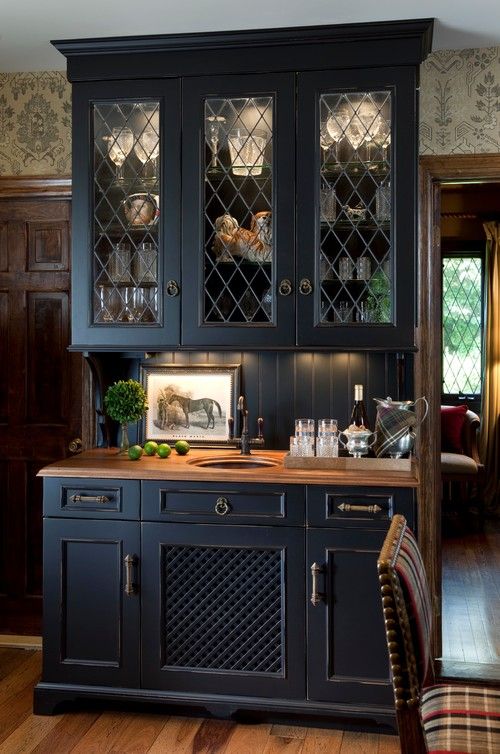 a midnight blue buffet with built-in lights and light-stained brown countertops for a chic and bold look