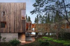 01 This contemporary treehouse-inspired cabin is built on stilts and features a U-shape and a central courtyard