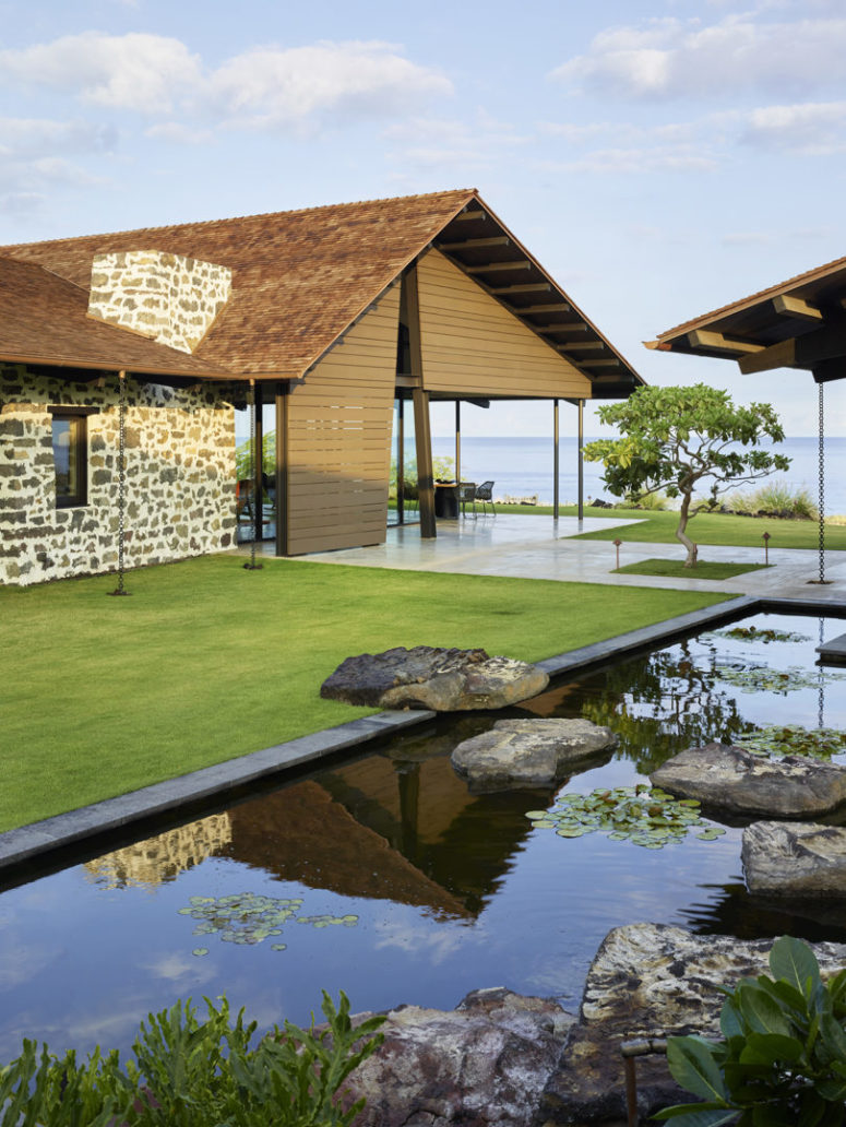 This modern home in Hawaii sits on a hardened lava field and overlooks the seaside