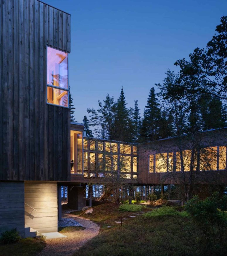 The exterior of the cabin is clad in wood which has a beautiful weathered patina
