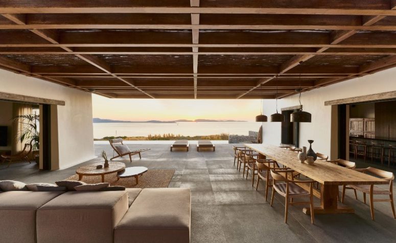 The main layout comprises a dining space, a living room and a space by the pool that are united in one