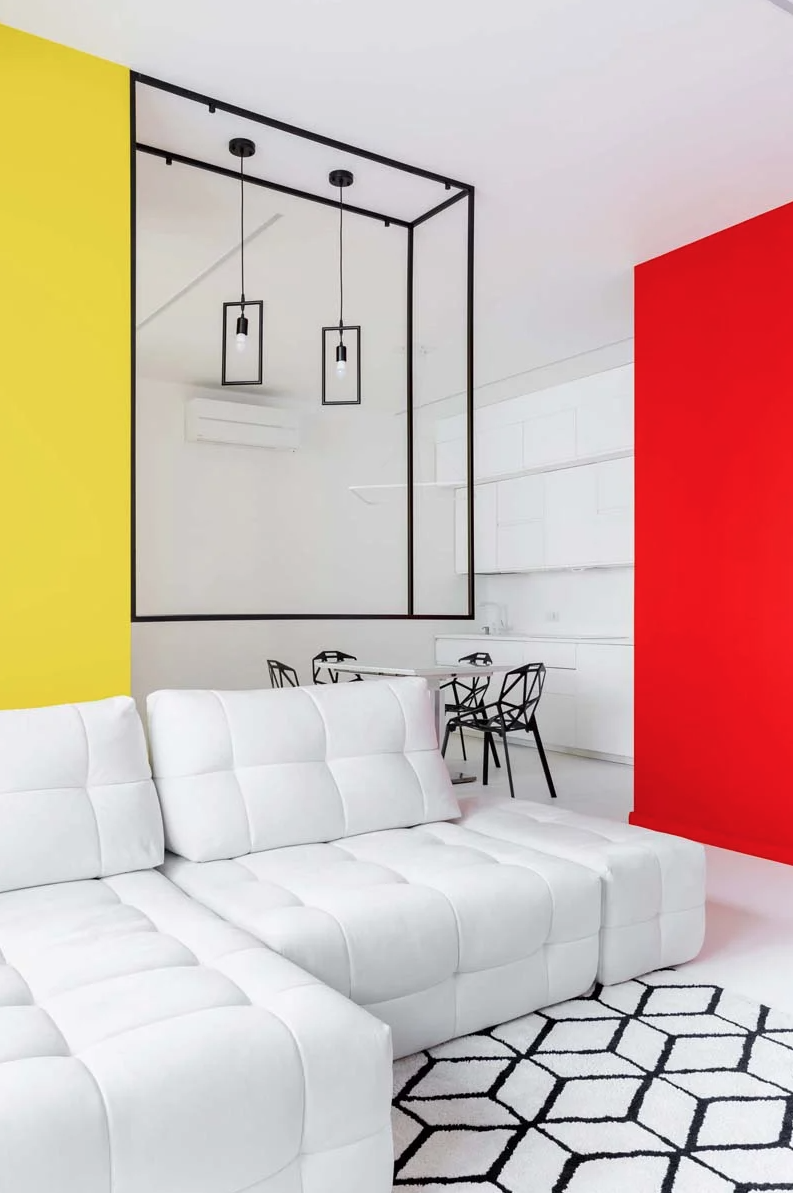 The main layout is an open space with again black and white decor and super bright colorful touches