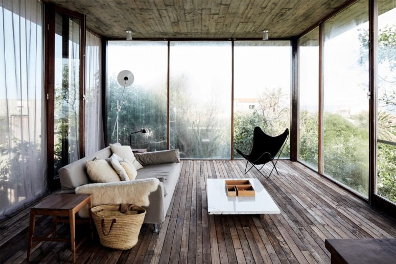 The second living room features amazing views and chic modern furniture