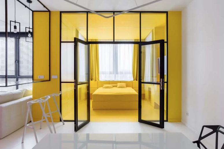 The bedroom is done bright yellow to forget about dull grey weather outdoors that often happens here