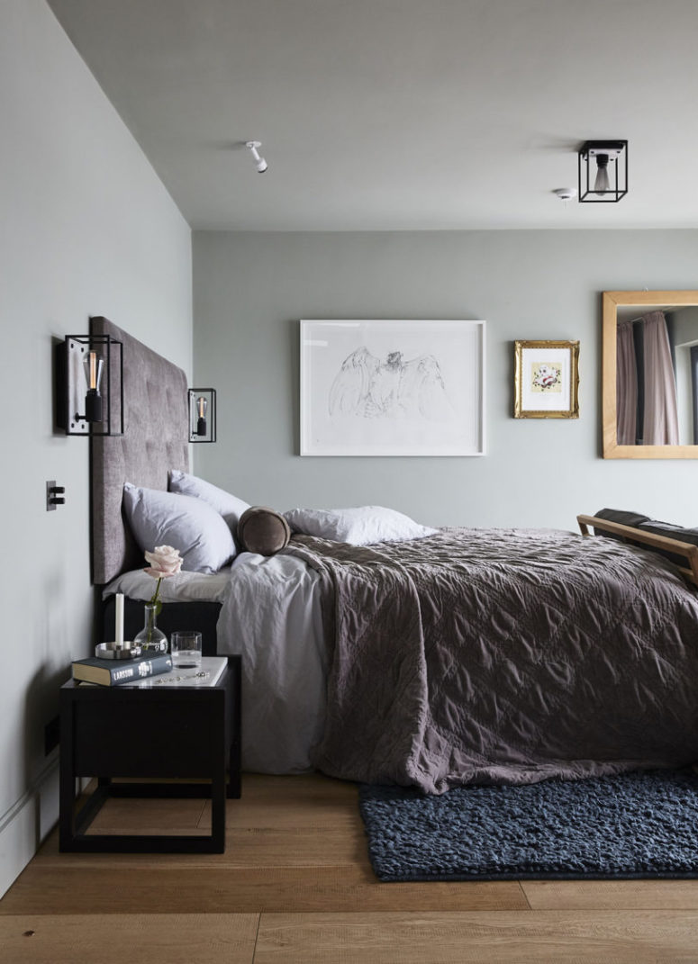 The master bedroom is very soothing, with grey walls, a gallery wall, dusty pink textiles and touches of black The master bedroom is very soothing, with grey walls, a gallery wall, dusty pink textiles and touches of black