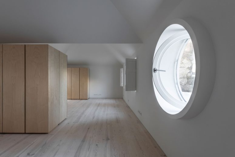 The rooms are done spacious, with hidden storage units and original shutters and a round window