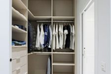 17 a small minimalist closet with lots of open storage space, dome drawers and holders for hangers, a creative stool and a glass sliding door