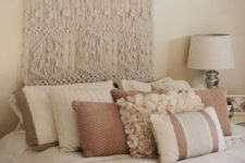18 a macrame wall hanging instead of a usual headboard is a creative idea to go for