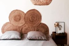 20 a stack of jute rugs, a wicker lamp make the bedroom feel more natural and more outdoor-inspired