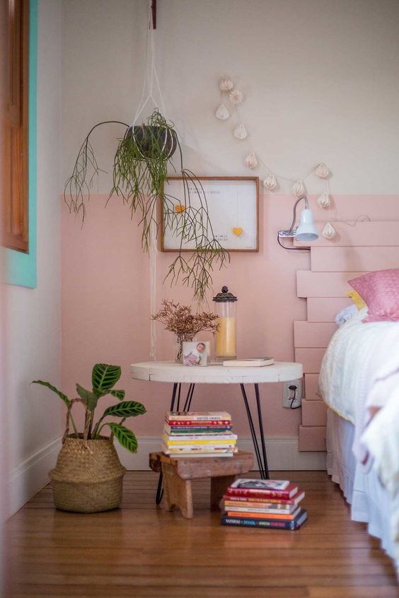 a blush wall and a blush plank headboard for adding a cool and glam feel to the space