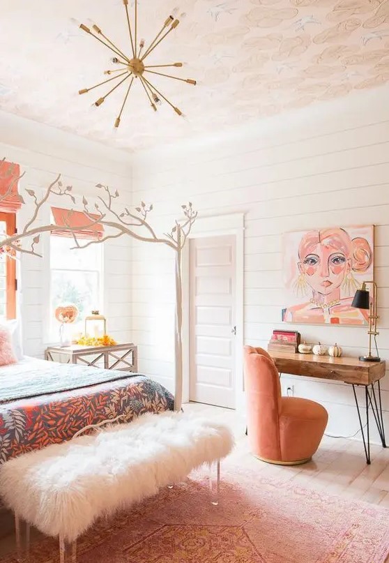 a catchy and bright feminine bedroom with pink textiles and bedding, a faux fur bench, a bright artwork and touches of bold is very chic