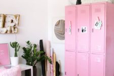 a catchy home office with a pink storage unit, a pink artwork and a fluffy chair plus gold touches looks super glam