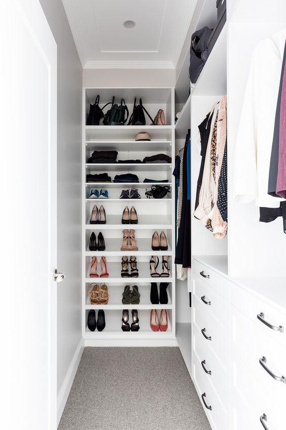 a small and narrow closet with shoe and bag shelves, open storage compartments with hangers and some drawers is a cool solution