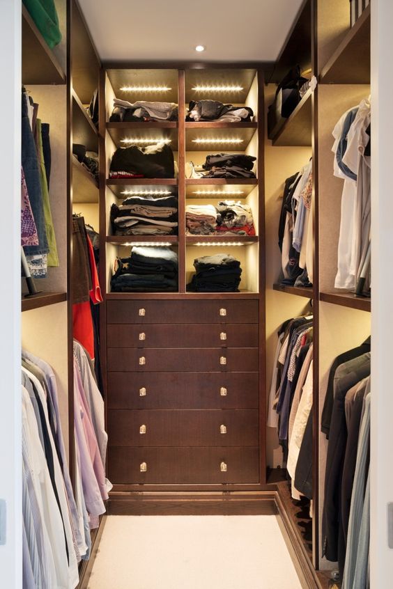 a small closet with open shelves and built-in lights, drawers for storage is a clever and cool solution for your home