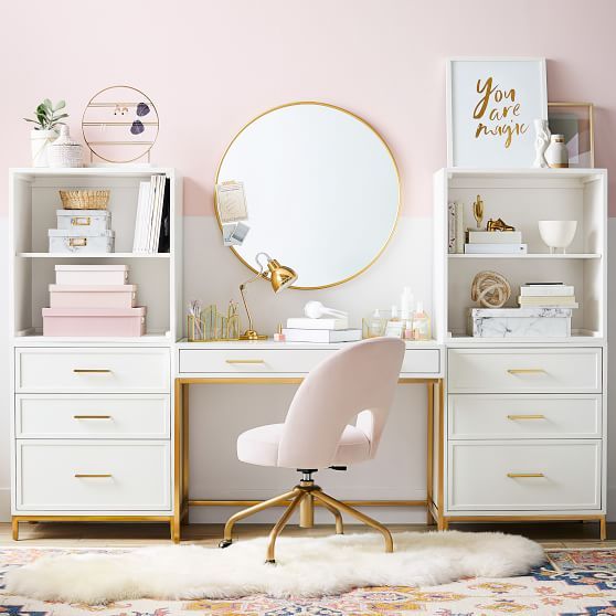 a stylish glam home office with a pink color block wlal, pink accessories and a chair and touches of gold