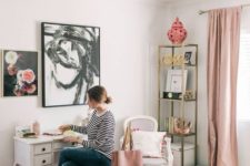 a stylish home office with blush curtains, a pink printed rug, some accessories and a grene ottoman for an eclectic look and feel