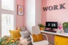 a super bold home office in pink, grey and mustard, with pink walls and a ceiling, with mustard accessories is a unique space