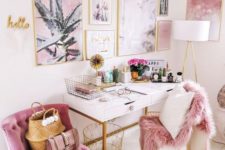 a super glam home office with a gorgeous gallery wall in gold frames, a pink chair and a faux fur cover is very welcoming