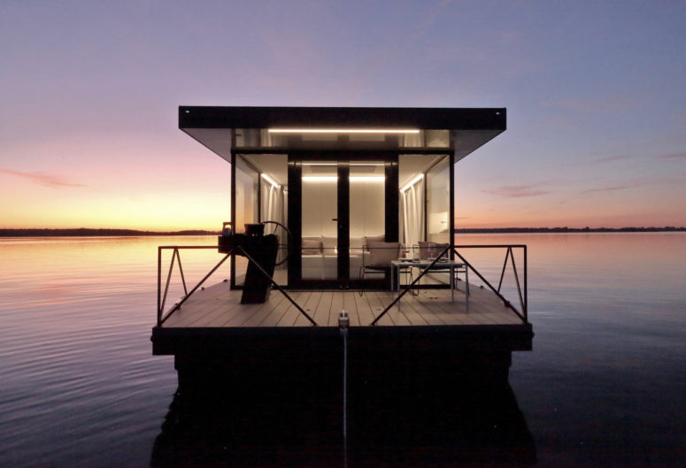 This small apartment on the water is called loungeboat and is a real boat home that is comfortable and stylish