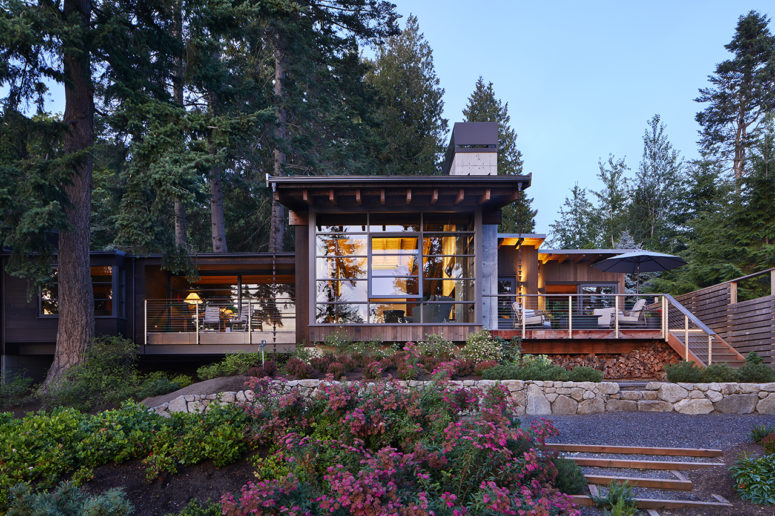 This gorgeous home is nested in a lush forest and features amazing views of the Northwest Pacific