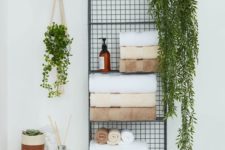 03 a metal wall shelf for storing towels, soaps, greenery in pots is a nice solution to save some floor space