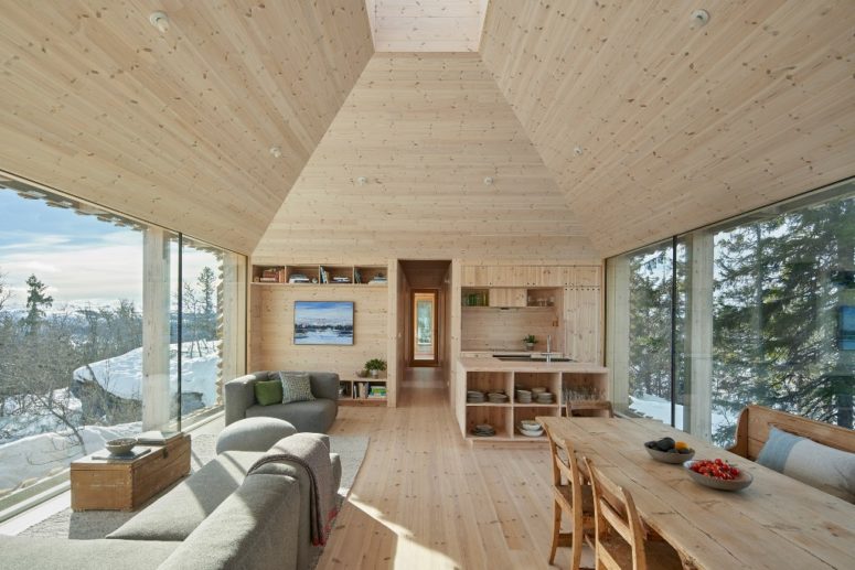 The interiors are clad with wood, the furniture is also made of wood to make it fele all-natural and welcoming