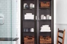 04 a glass closet with towels is a nice towel storage piece but it fits only a large bathroom