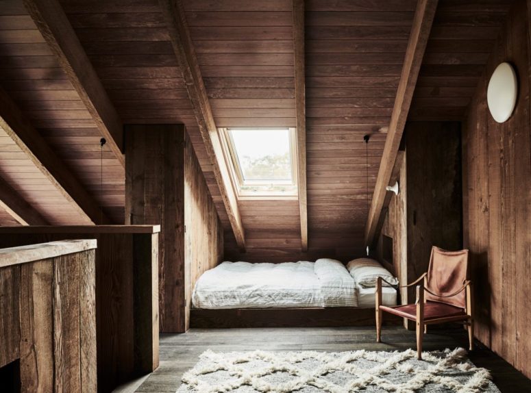 The upstairs bedroom area has a very cozy attic-like feeling due to the slanted ceiling