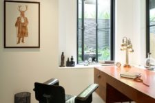 07 The home office is done with stylish mid-century modern furniture and much natural light