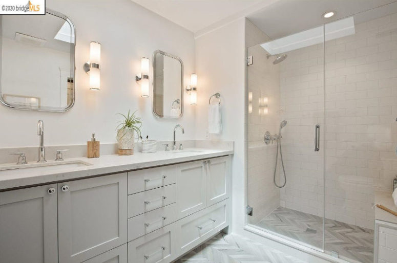 The master bathroom is done in neutrals, a double vanity and a shower space