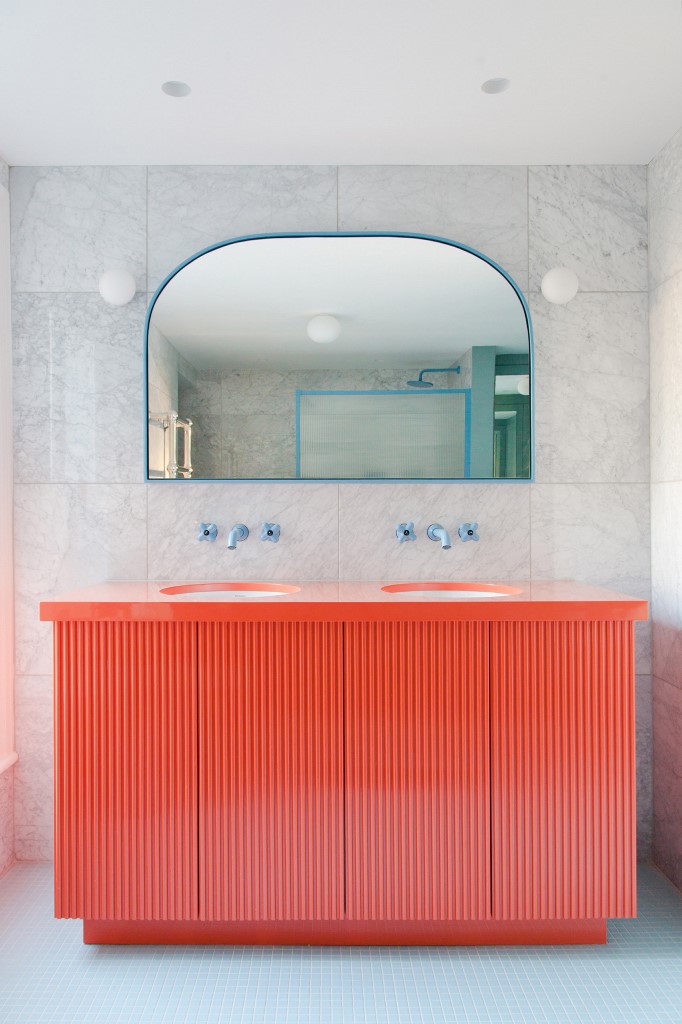 There's a red vanity and touches of blue - frames, fixtures and other details