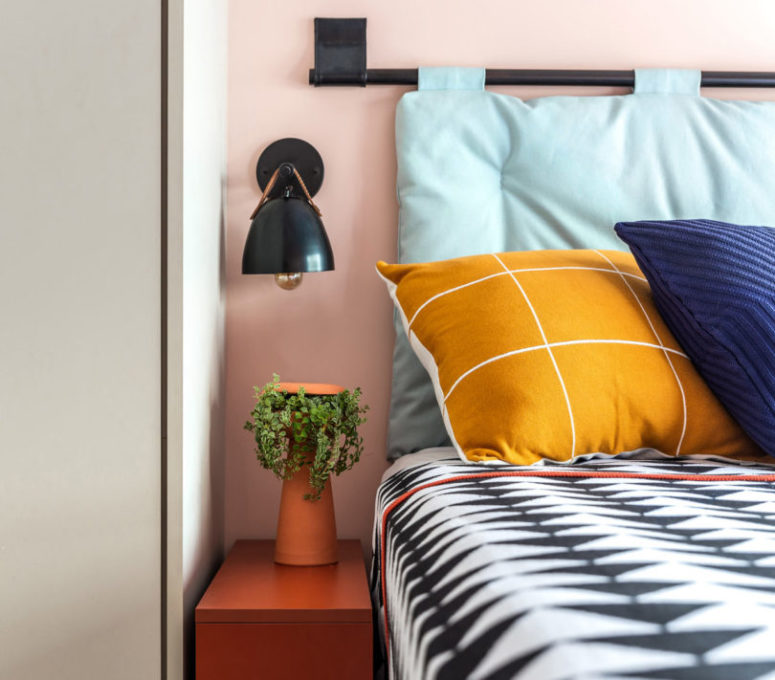 Bright bedding continues the decor style