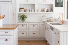 11 a vintage white kitchen accented with copper hardware to give more color and chic to the space