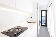 13 A kitchen is also present, it’s done in white, with built-in lights and a comfy surface for cooking