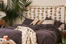 15 a boho bedroom with phases of the moon headboard in gold is a perfect choice for a celestial space