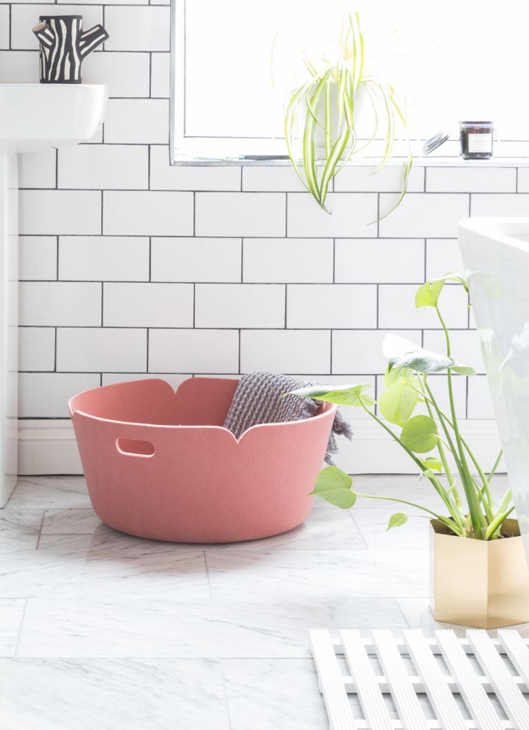 a pink felt laundry basket like this one can store a lot of towels and it looks pretty and cool