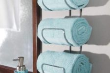 24 a stylish wall-mounted towel holder attached by the sink is a life changer that will save much space