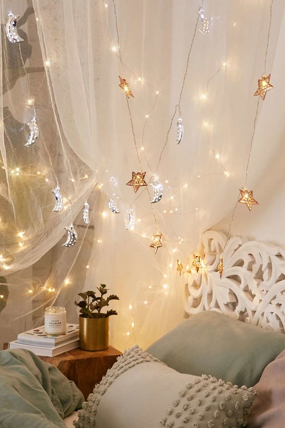 gold star and silver moon lights over the bed will make your dreams celestial and romantic
