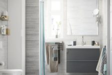25 a wall-mounted multi-rail towel storage piece is a smart and cool towel storage unit for any bathroom