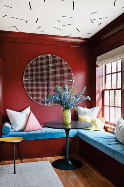 a bright entryway made quirky and funny with a whimsy wallpaper ceiling in black and white